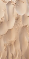 A close up view of a sandy surface. Perfect for backgrounds or textures in design projects.