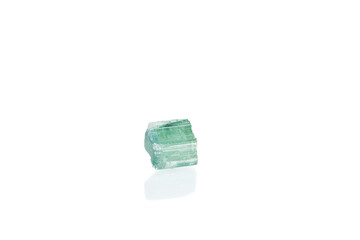 green tourmaline mineral stone macro on white background