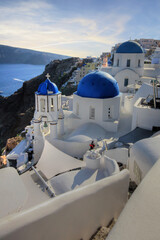 beautiful view of the blue dome of Oia in Santorini (Greece) - 671729506