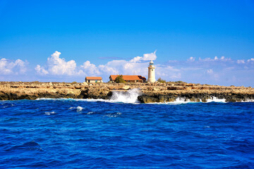 View from the sea towards the lighthouse on the island.