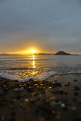 sunset on the beach. Seaside town of Turgutreis and spectacular sunsets. Selective Focus.