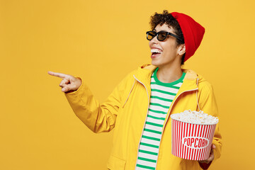 Young woman wear 3d glasses wear waterproof raincoat outerwear red hat watch movie film hold bucket...