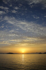 sunset on the beach. Seaside town of Turgutreis and spectacular sunsets. Selective Focus.