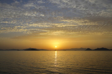 Fototapeta premium sunset on the beach. Seaside town of Turgutreis and spectacular sunsets. Selective Focus.
