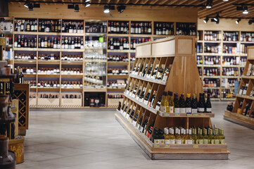 Empty fine modern wine aisle rows in alcohol beverage department at supermarket store grocery shop...