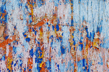 Minimalist colourful textured background of old and rusted whit, blue, brown and orange  paing on...