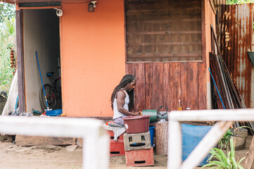 Image of a black artisan working at home