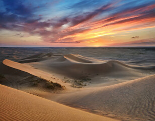 Fototapeta na wymiar Sunset Over the Desert Dunes