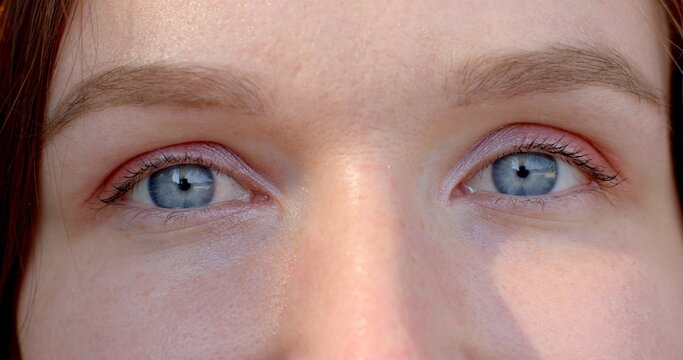 Close-up woman eyes, sense of intimacy and connection between viewer and subject, blue color of the iris. powerful symbol of a person's identity eyes close up. Recognizable features of an individual.