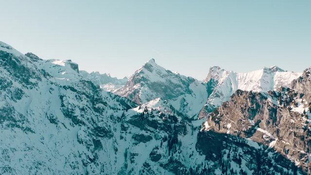Epic shots of a quadcopter among snow-capped mountains. Amazing landscapes and impressive nature views