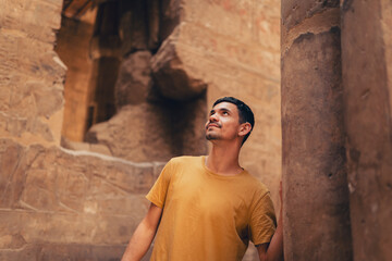 young male traveler visits Luxor temple in Luxor, Egypt