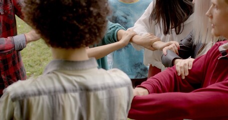 People during group somatic therapy to self-discovery, emotional healing, personal growth, connection between body and mind. Ukranian refuges ptsd trauma psychotherapy People in circle joined hands.  - obrazy, fototapety, plakaty
