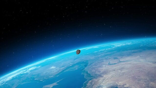 Asteroid hitting the Earth. Planet Earth and big asteroid in the space. Potentially hazardous object. Meteorite hitting the Earth. Elements of this video furnished by NASA. 