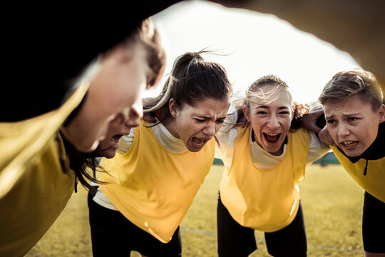 Female soccer team displaying intense emotions during a game
