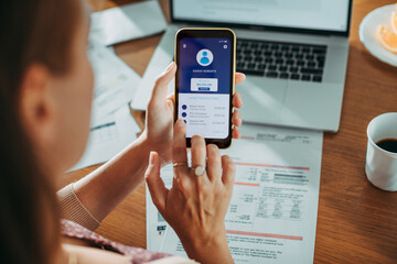 Woman checking her account details on a smartphone app