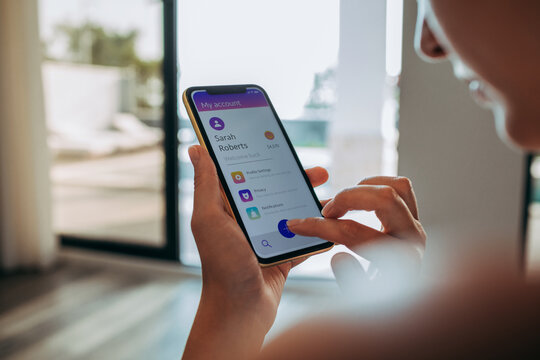 Woman checking her account details on a smartphone app