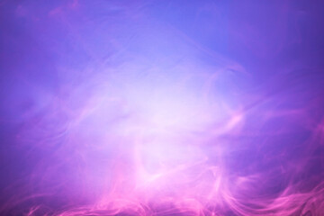 Blurred pink and purple smoke on light blue background. Soft smoke texture