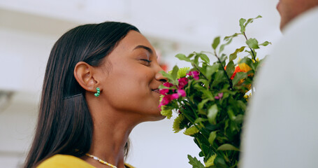Home, gift and woman smell flowers with a smile on valentines day, anniversary or surprise from...