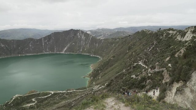 laguna quilotoa at the quilotoa loop in the andes mountains of Ecuador, is an emerald green lake in a caldera of an old volcano cater and a popular travel destination for hikers.