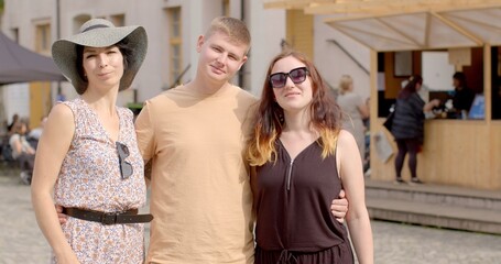 Man with two women posing. Romantic relationships among three individuals polyamory, involve consensually and openly loving and connecting with multiple partners simultaneously.