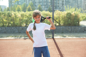 little Girl playing paddle tennis