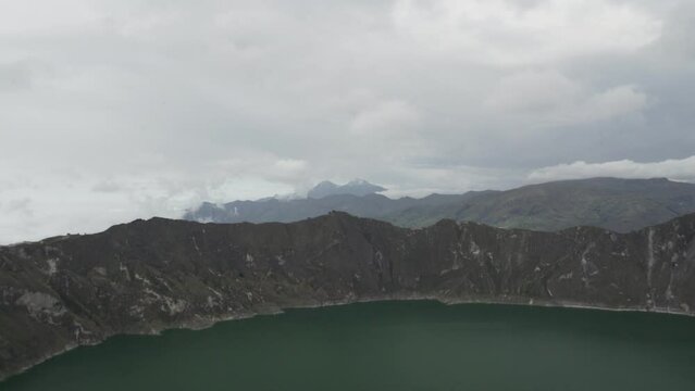 laguna quilotoa at the quilotoa loop in the andes mountains of Ecuador, is an emerald green lake in a caldera of an old volcano cater and a popular travel destination for hikers.