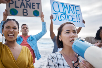 Megaphone, climate change and Asian woman protest with crowd at beach protesting for environment...