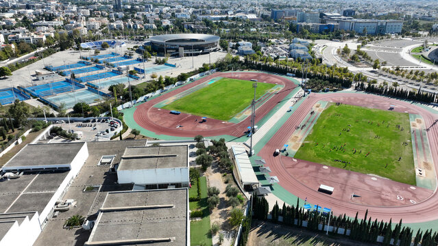 Aerial drone panoramic view of sports facilities of OAKA and Olympic Stadium designed by Santiago Calatrava, Klogreza, Attica, Greece