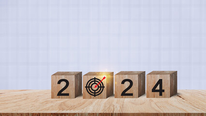 2024 goals of business or life, Wooden cubes with 2024 and goal icon on smart background, Starting...