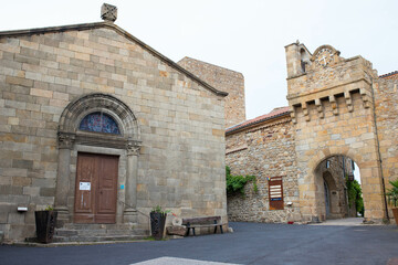Fototapeta na wymiar The church of Assumption (Eglise de l'Assomption) in the charming medieval village of Montpeyroux, Auvergne, France.