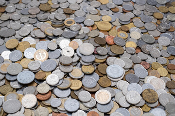 diverse collection of coins from different countries and denominations, representing the concept of numismatics and saving money. - obrazy, fototapety, plakaty