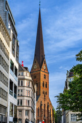 Fototapeta na wymiar Hamburg, Germany. The Church of Saint Peter (German: St. Petri, coll.: Petrikirche) with downtown buildings.
