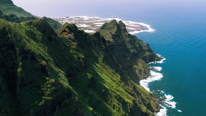 Green mountain range on ocean coastline near Punta del Hidalgo town. Anaga rural park in Tenerife,...