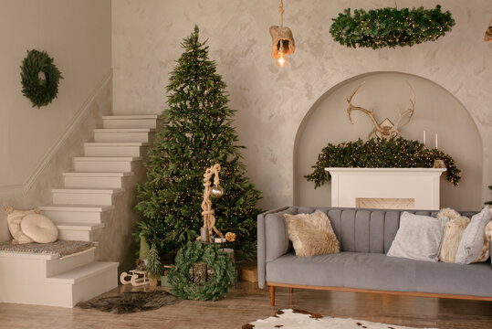 new year cozy home interior with Christmas tree and garlands 