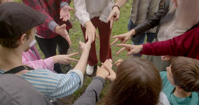 Group people plays rock paper scissors impartial method making decisions. Fair Conflict Resolution. Playing game random determine winner. Social gatherings background 