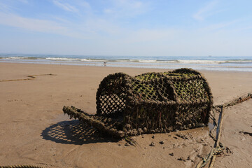 Old lobster pot washed on a beach