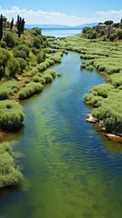 A river crossing by greenery.UHD wallpaper