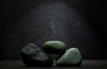 minimalist composition of natural stones for product presentation. zen stones for the podium on a...