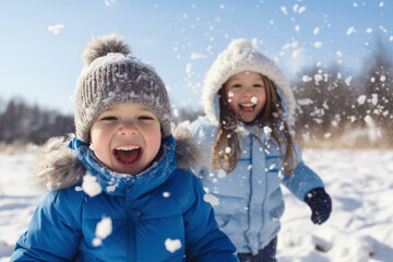Fototapeta na wymiar Children joyfully playing in the snow