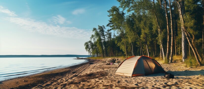 Beachside tent camp in a mixed forest offering outdoor recreation as a getaway from noisy cities Located on Russias Rybinsk reservoir shore