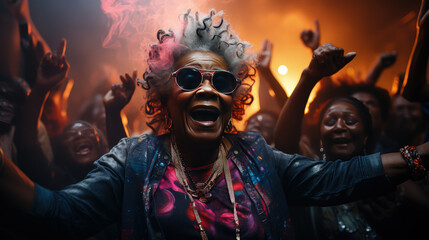 Stylish elderly African American woman in fashionable glasses dances funny in a nightclub. Senior...