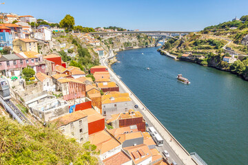Fototapeta na wymiar Aerial view of Ribeira, the Dom Luis bridge and the Douro river in Porto, Portugal