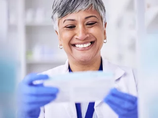 Fotobehang Happy, pharmacist or senior woman with medication, package and smile with treatment. Mature lady, female person or healthcare professional with happiness, medical or pharmacy with employee or reading © D Theron/peopleimages.com