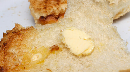 bread with butbread and butter. bread and butter details. melted butter on bread. bread texture.ter.