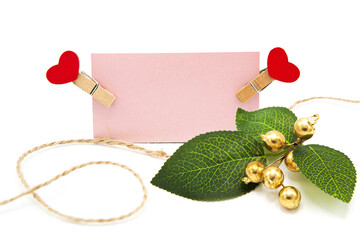 Greeting blank card on a rope on clothespins with hearts. Love. Christmas. New Year. Valentine's...