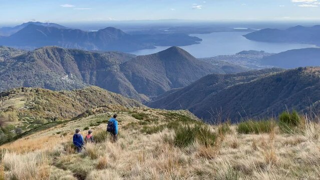 Father and his sons hiking in Val Grande, national park close to Lago Maggiore, Italy,