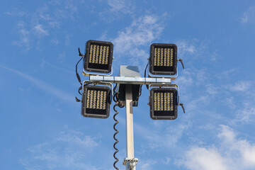 Floodlights on a mast for illuminating construction sites. LED spotlights close up