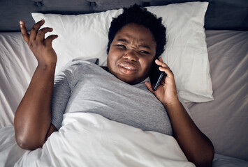 Confused, above and a black woman on a phone call in bed for communication, conversation or a chat. Frustrated, home and an African girl or person speaking on a mobile in the bedroom in the morning - obrazy, fototapety, plakaty