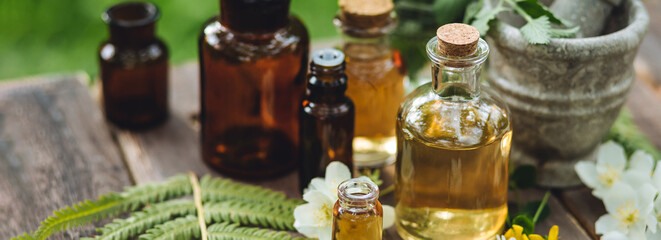 Concept of pure organic essential oil in glass bottles in cosmetology. Moisturising skin care,...