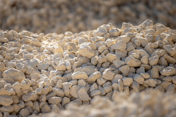 Crushed stone, selected focus. Crushed stones for road repair. Hills of crushed stone in the...
